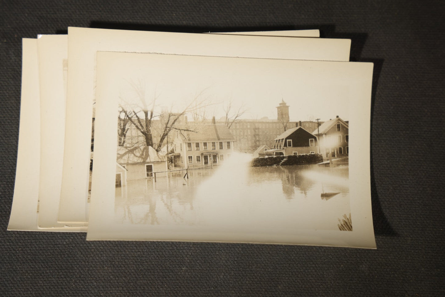 Vintage Grouping of Approximately 40 Snapshot Photographs and Negatives Documenting a Flood in Nashua, New Hampshire, in Fred W. Perkins Photo Finishing Envelope Marked "Flood Films"