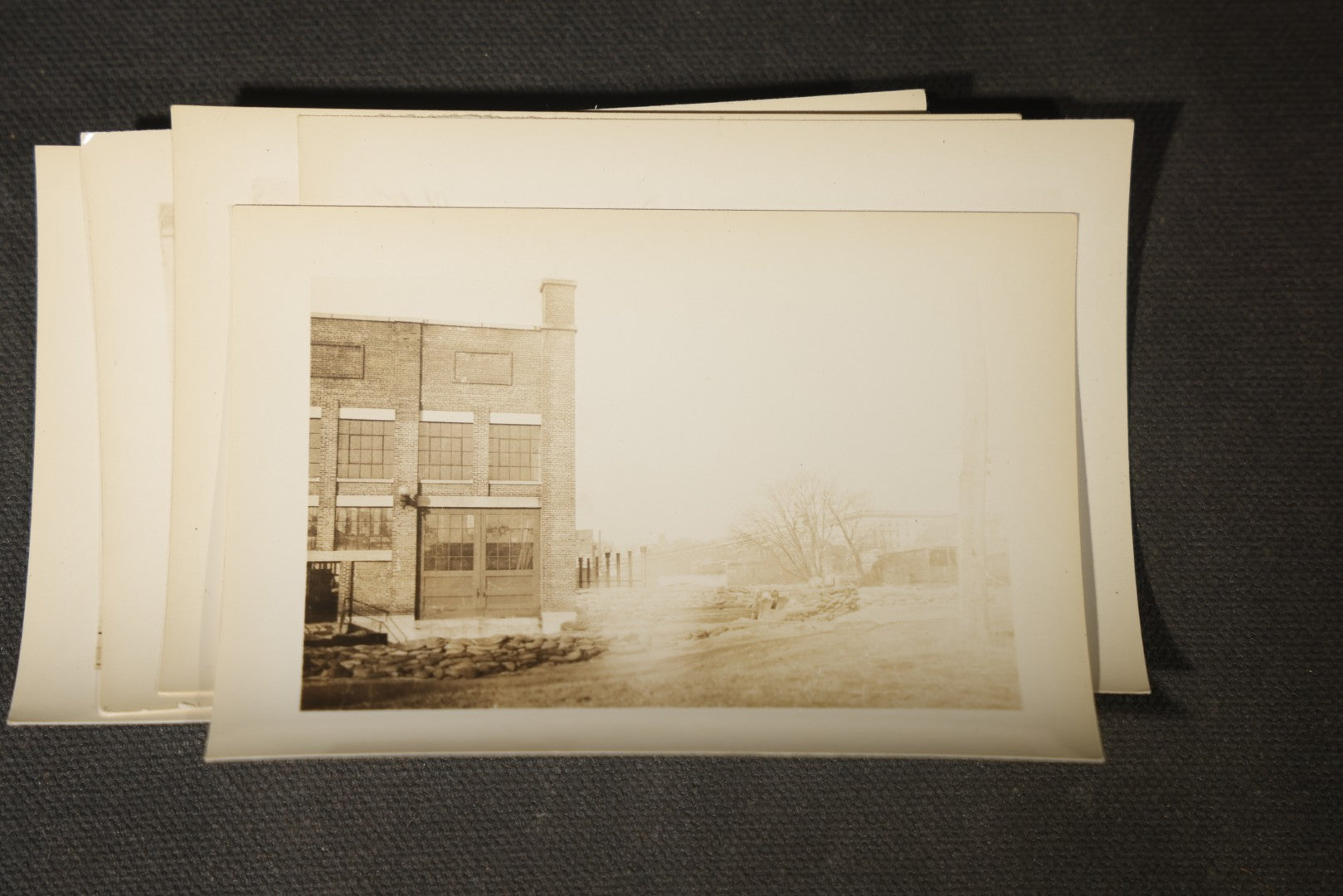 Vintage Grouping of Approximately 40 Snapshot Photographs and Negatives Documenting a Flood in Nashua, New Hampshire, in Fred W. Perkins Photo Finishing Envelope Marked "Flood Films"