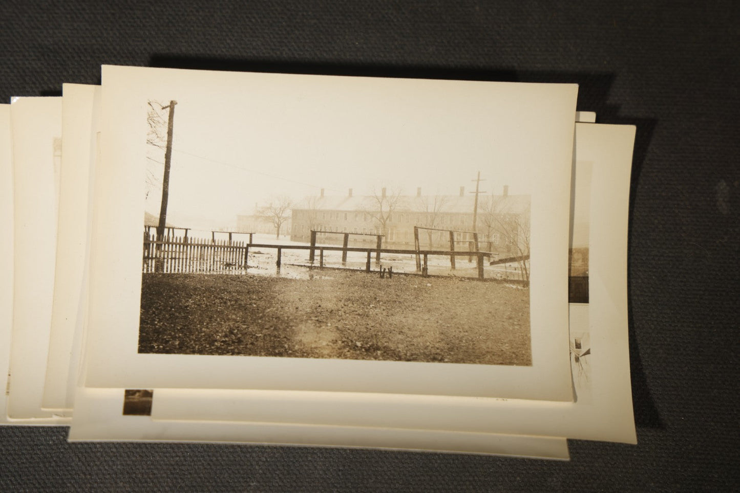 Vintage Grouping of Approximately 40 Snapshot Photographs and Negatives Documenting a Flood in Nashua, New Hampshire, in Fred W. Perkins Photo Finishing Envelope Marked "Flood Films"