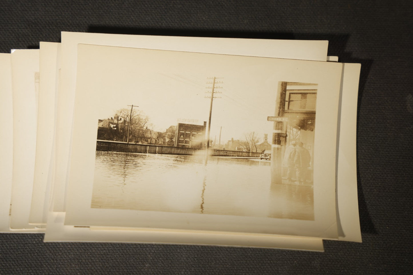 Vintage Grouping of Approximately 40 Snapshot Photographs and Negatives Documenting a Flood in Nashua, New Hampshire, in Fred W. Perkins Photo Finishing Envelope Marked "Flood Films"