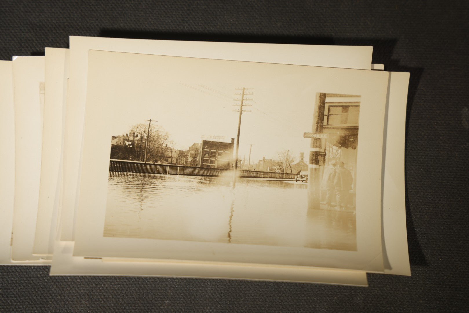 Vintage Grouping of Approximately 40 Snapshot Photographs and Negatives Documenting a Flood in Nashua, New Hampshire, in Fred W. Perkins Photo Finishing Envelope Marked "Flood Films"