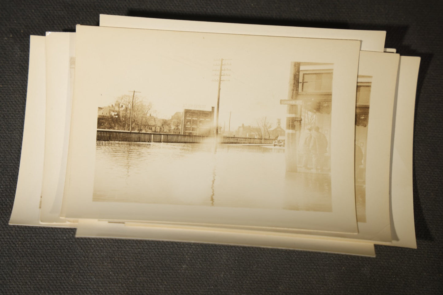 Vintage Grouping of Approximately 40 Snapshot Photographs and Negatives Documenting a Flood in Nashua, New Hampshire, in Fred W. Perkins Photo Finishing Envelope Marked "Flood Films"
