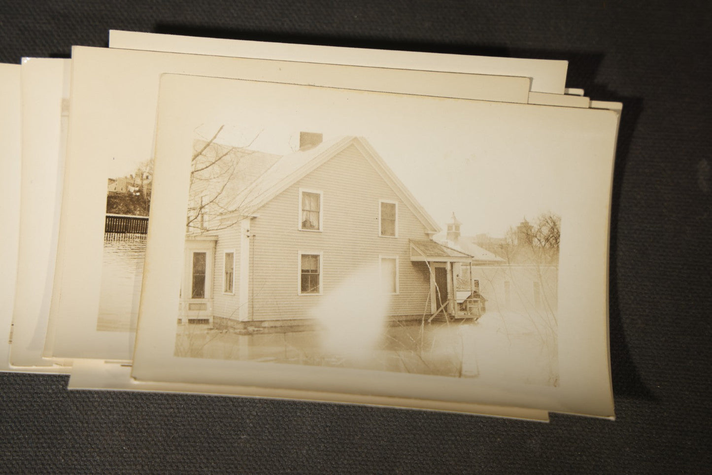 Vintage Grouping of Approximately 40 Snapshot Photographs and Negatives Documenting a Flood in Nashua, New Hampshire, in Fred W. Perkins Photo Finishing Envelope Marked "Flood Films"