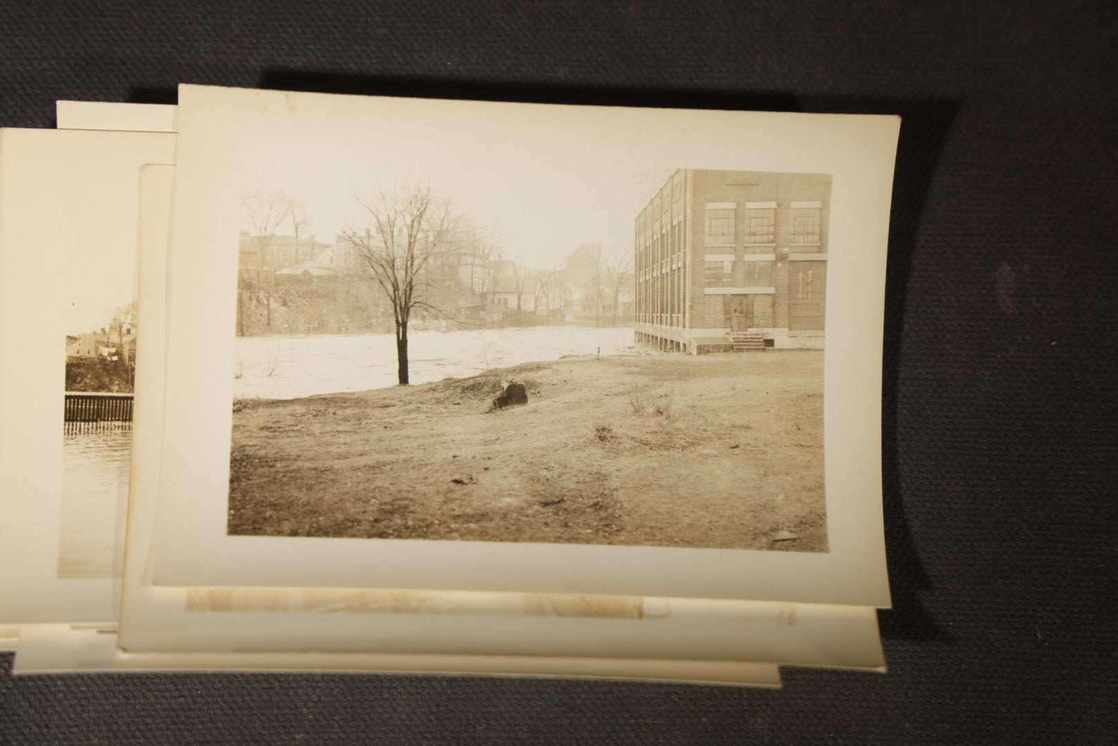 Vintage Grouping of Approximately 40 Snapshot Photographs and Negatives Documenting a Flood in Nashua, New Hampshire, in Fred W. Perkins Photo Finishing Envelope Marked "Flood Films"
