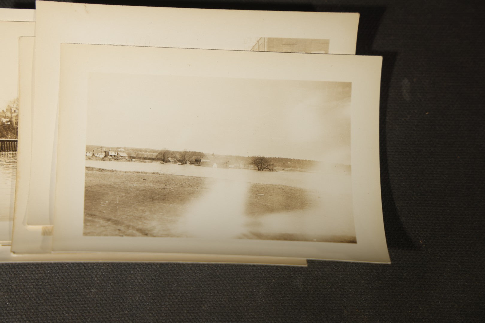 Vintage Grouping of Approximately 40 Snapshot Photographs and Negatives Documenting a Flood in Nashua, New Hampshire, in Fred W. Perkins Photo Finishing Envelope Marked "Flood Films"