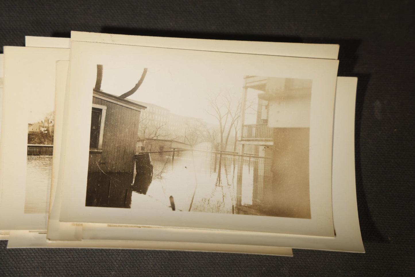 Vintage Grouping of Approximately 40 Snapshot Photographs and Negatives Documenting a Flood in Nashua, New Hampshire, in Fred W. Perkins Photo Finishing Envelope Marked "Flood Films"