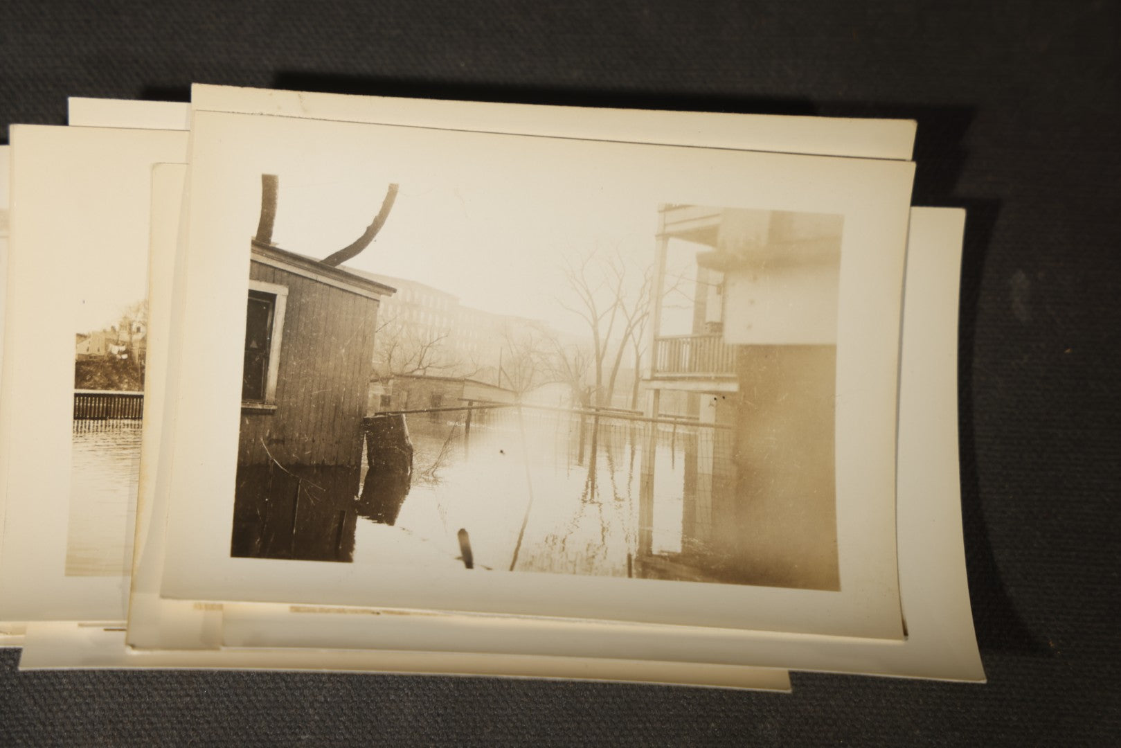 Vintage Grouping of Approximately 40 Snapshot Photographs and Negatives Documenting a Flood in Nashua, New Hampshire, in Fred W. Perkins Photo Finishing Envelope Marked "Flood Films"
