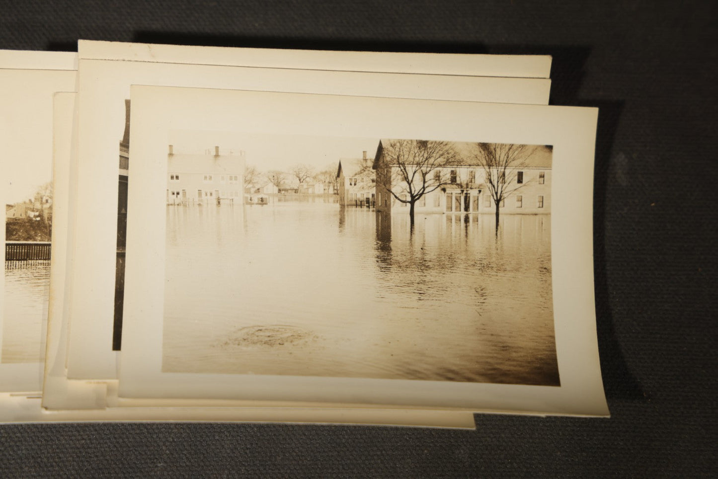 Vintage Grouping of Approximately 40 Snapshot Photographs and Negatives Documenting a Flood in Nashua, New Hampshire, in Fred W. Perkins Photo Finishing Envelope Marked "Flood Films"