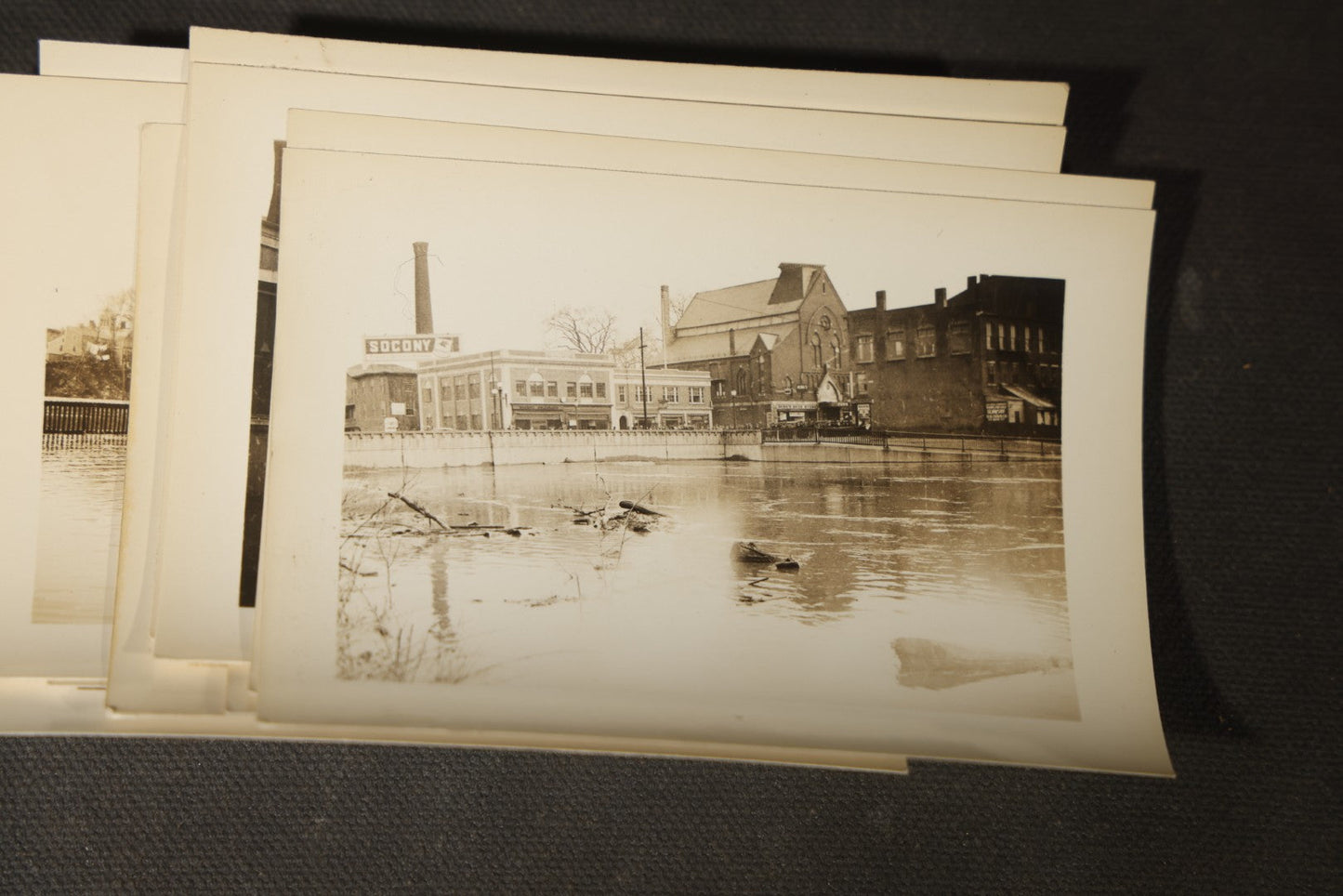 Vintage Grouping of Approximately 40 Snapshot Photographs and Negatives Documenting a Flood in Nashua, New Hampshire, in Fred W. Perkins Photo Finishing Envelope Marked "Flood Films"