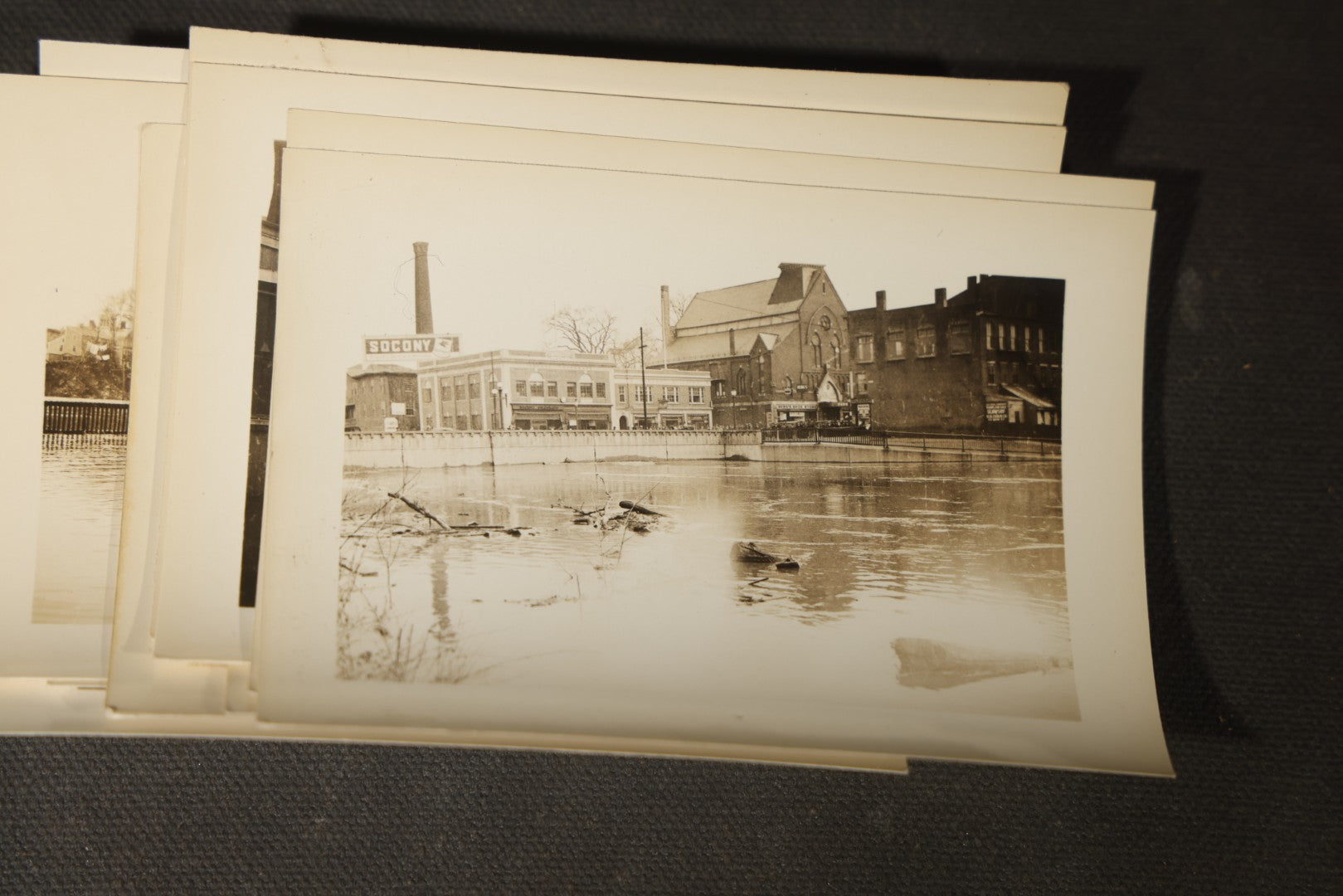 Vintage Grouping of Approximately 40 Snapshot Photographs and Negatives Documenting a Flood in Nashua, New Hampshire, in Fred W. Perkins Photo Finishing Envelope Marked "Flood Films"
