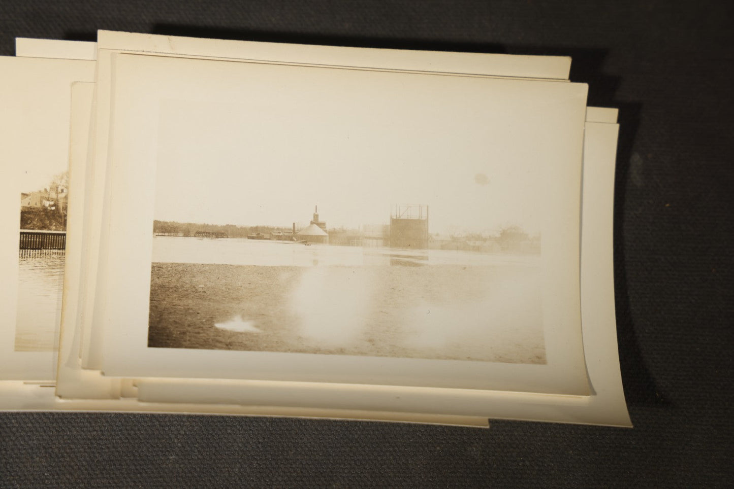 Vintage Grouping of Approximately 40 Snapshot Photographs and Negatives Documenting a Flood in Nashua, New Hampshire, in Fred W. Perkins Photo Finishing Envelope Marked "Flood Films"