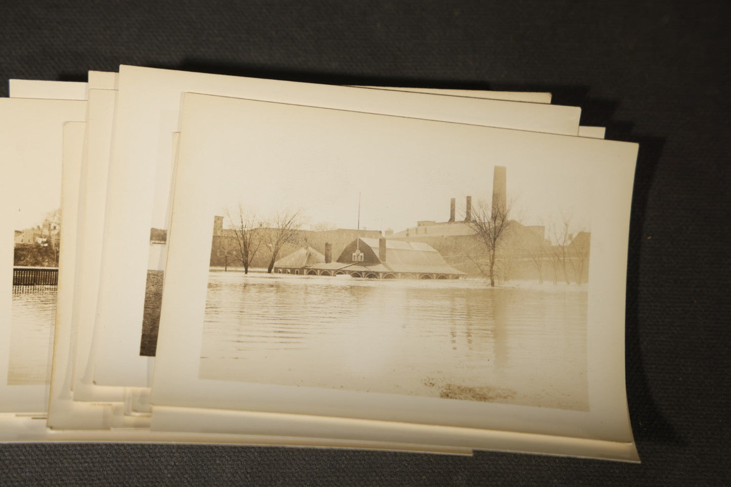 Vintage Grouping of Approximately 40 Snapshot Photographs and Negatives Documenting a Flood in Nashua, New Hampshire, in Fred W. Perkins Photo Finishing Envelope Marked "Flood Films"