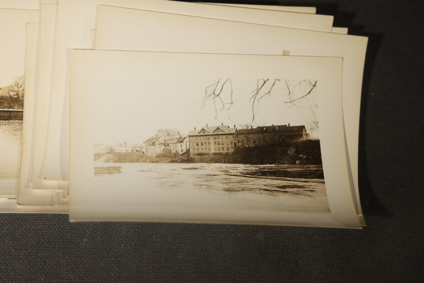 Vintage Grouping of Approximately 40 Snapshot Photographs and Negatives Documenting a Flood in Nashua, New Hampshire, in Fred W. Perkins Photo Finishing Envelope Marked "Flood Films"