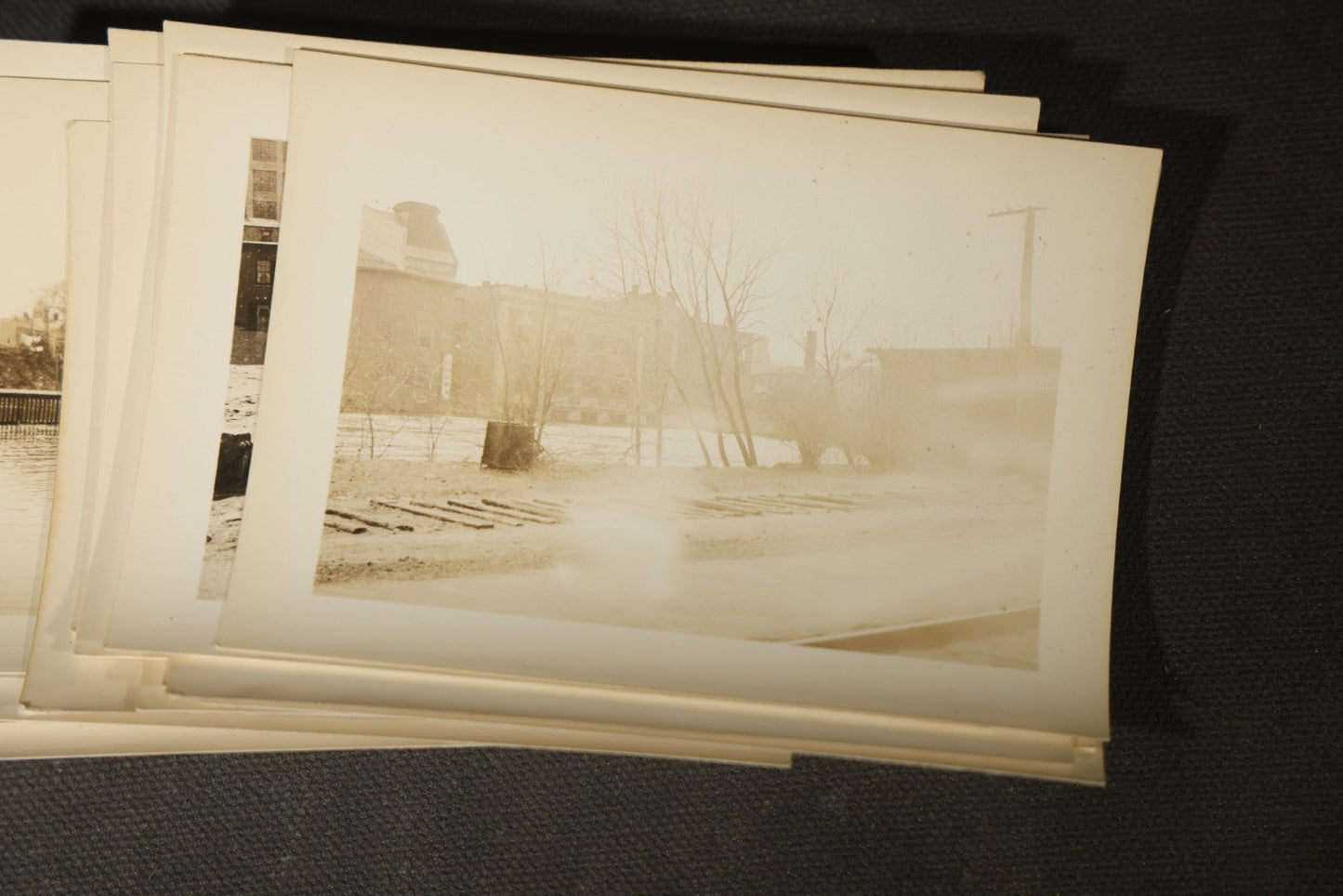 Vintage Grouping of Approximately 40 Snapshot Photographs and Negatives Documenting a Flood in Nashua, New Hampshire, in Fred W. Perkins Photo Finishing Envelope Marked "Flood Films"