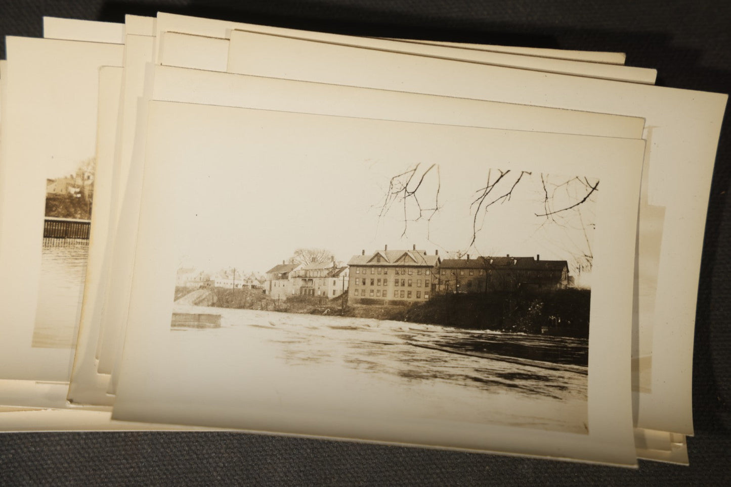Vintage Grouping of Approximately 40 Snapshot Photographs and Negatives Documenting a Flood in Nashua, New Hampshire, in Fred W. Perkins Photo Finishing Envelope Marked "Flood Films"