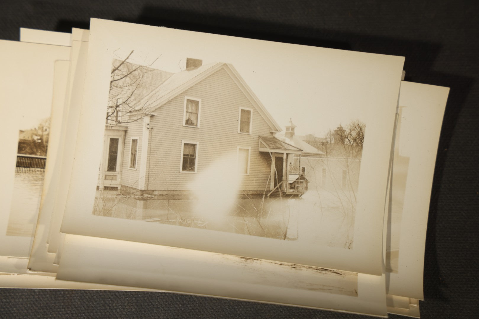 Vintage Grouping of Approximately 40 Snapshot Photographs and Negatives Documenting a Flood in Nashua, New Hampshire, in Fred W. Perkins Photo Finishing Envelope Marked "Flood Films"