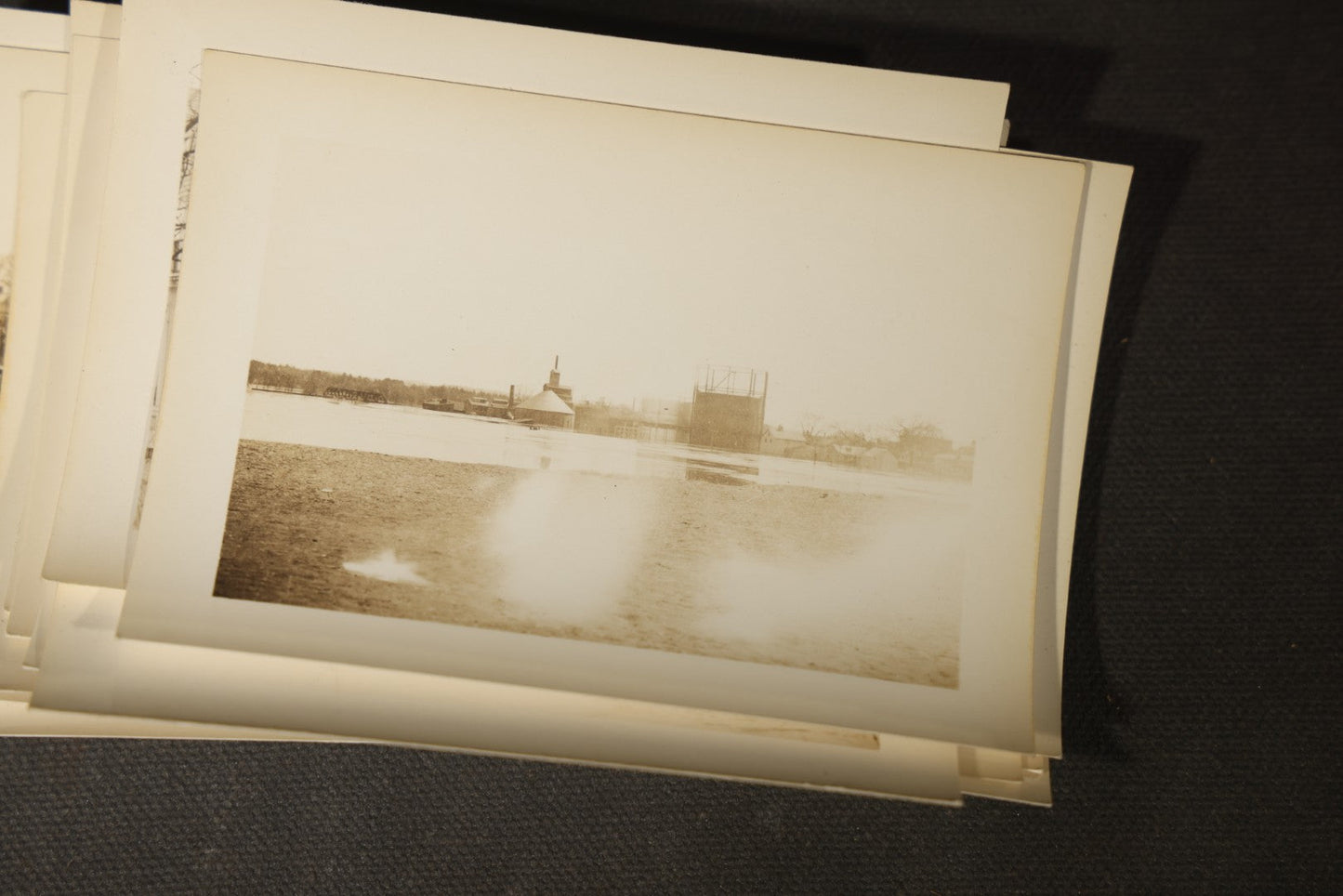 Vintage Grouping of Approximately 40 Snapshot Photographs and Negatives Documenting a Flood in Nashua, New Hampshire, in Fred W. Perkins Photo Finishing Envelope Marked "Flood Films"