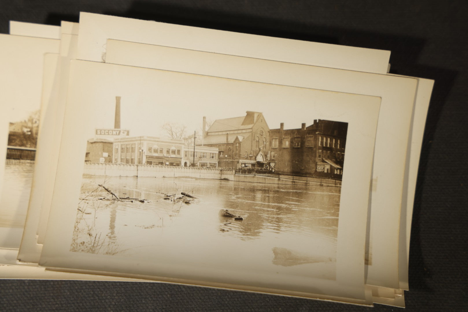 Vintage Grouping of Approximately 40 Snapshot Photographs and Negatives Documenting a Flood in Nashua, New Hampshire, in Fred W. Perkins Photo Finishing Envelope Marked "Flood Films"