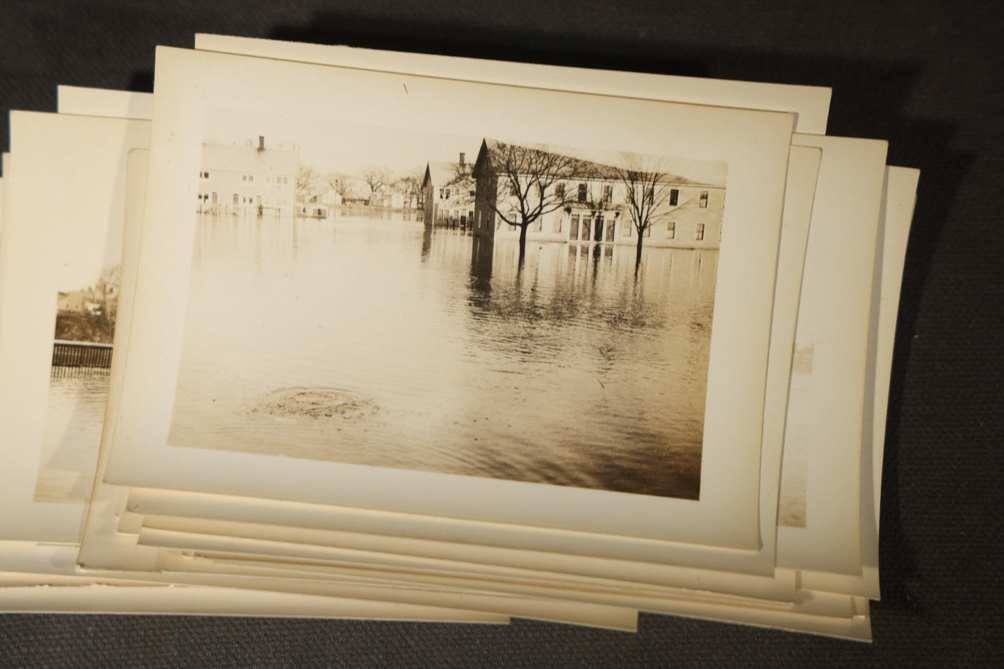 Vintage Grouping of Approximately 40 Snapshot Photographs and Negatives Documenting a Flood in Nashua, New Hampshire, in Fred W. Perkins Photo Finishing Envelope Marked "Flood Films"