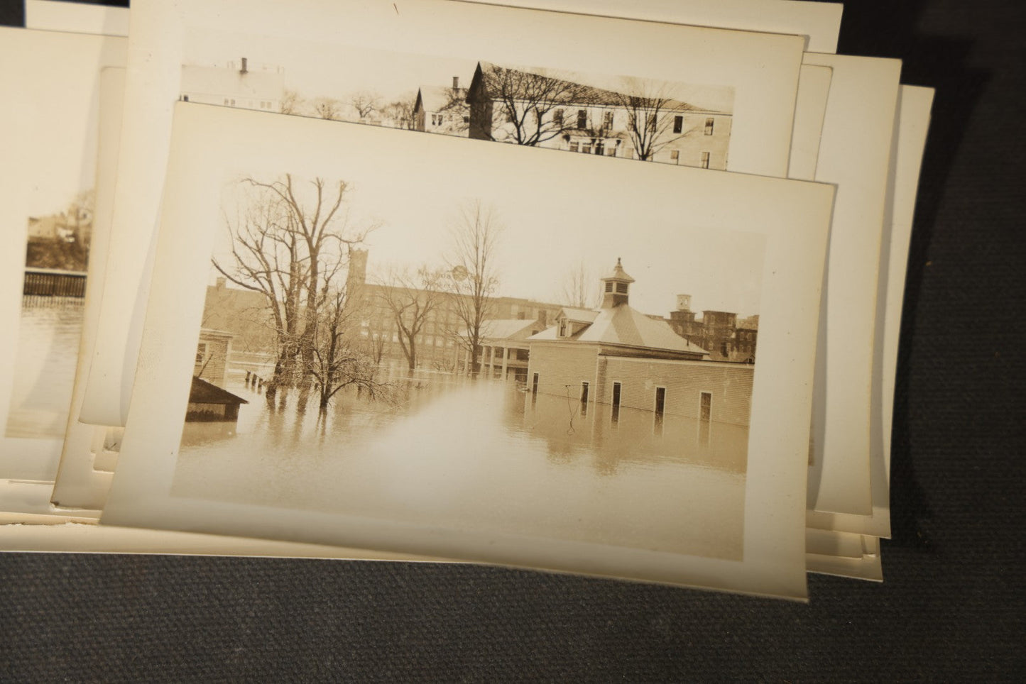 Vintage Grouping of Approximately 40 Snapshot Photographs and Negatives Documenting a Flood in Nashua, New Hampshire, in Fred W. Perkins Photo Finishing Envelope Marked "Flood Films"