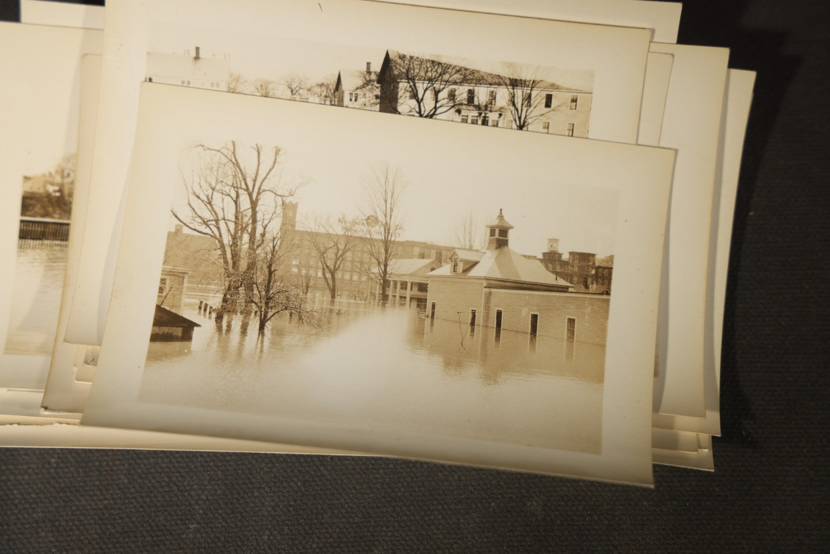 Vintage Grouping of Approximately 40 Snapshot Photographs and Negatives Documenting a Flood in Nashua, New Hampshire, in Fred W. Perkins Photo Finishing Envelope Marked "Flood Films"