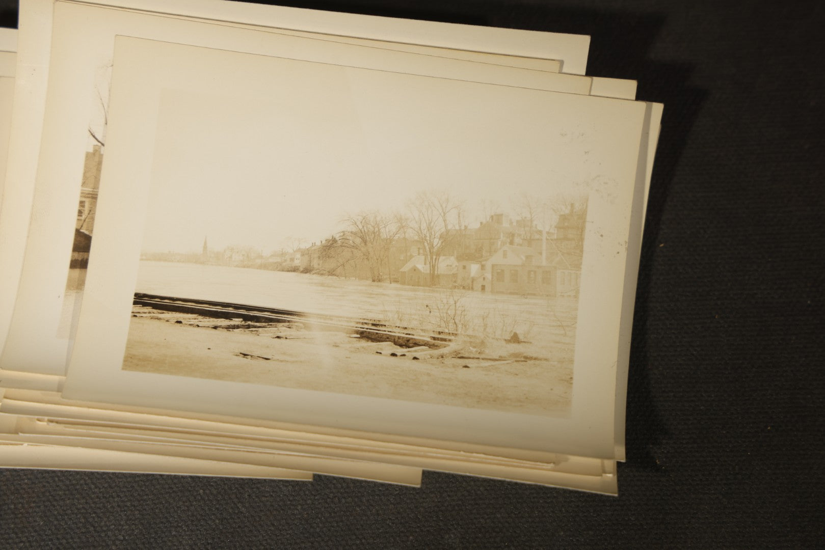 Vintage Grouping of Approximately 40 Snapshot Photographs and Negatives Documenting a Flood in Nashua, New Hampshire, in Fred W. Perkins Photo Finishing Envelope Marked "Flood Films"