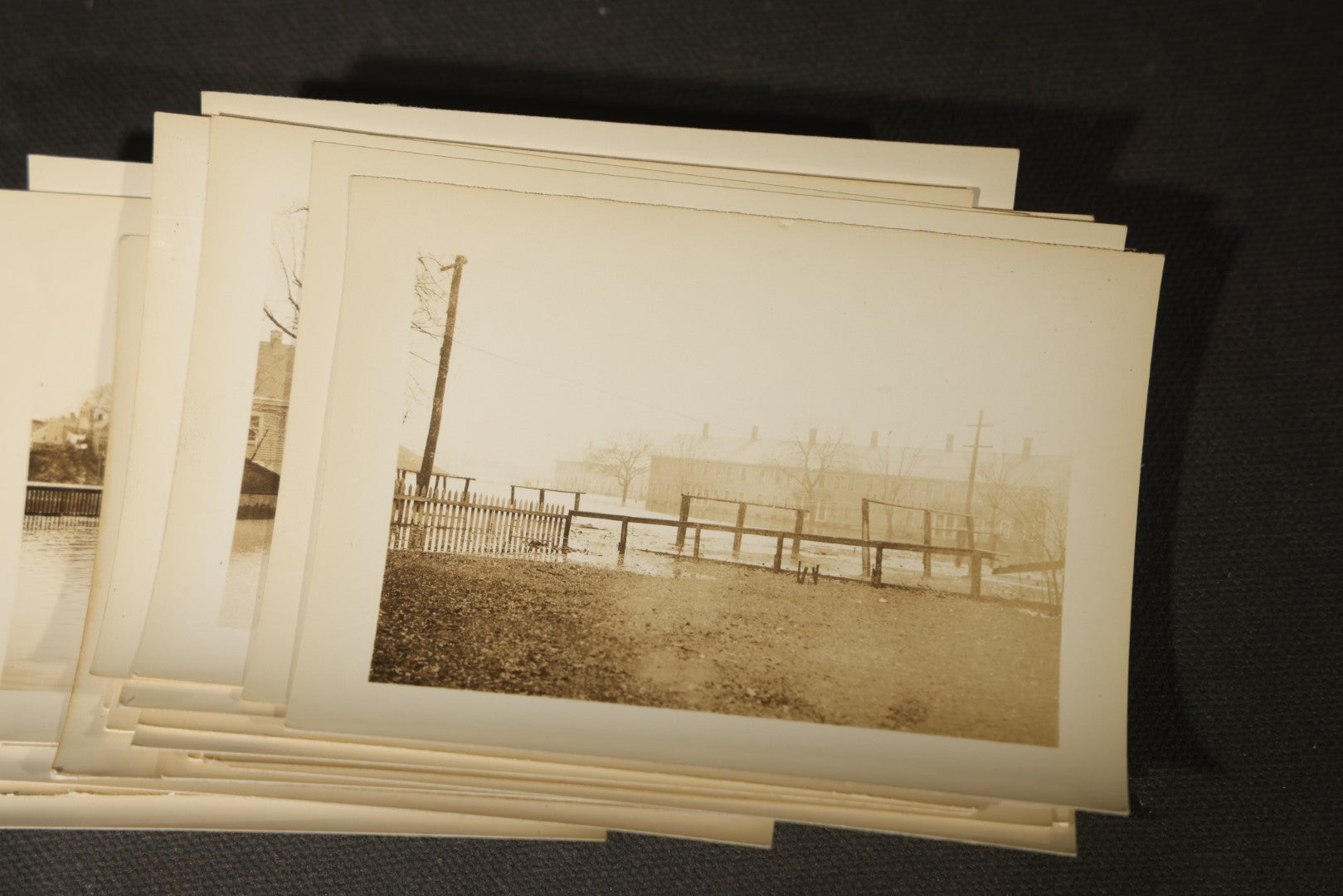 Vintage Grouping of Approximately 40 Snapshot Photographs and Negatives Documenting a Flood in Nashua, New Hampshire, in Fred W. Perkins Photo Finishing Envelope Marked "Flood Films"