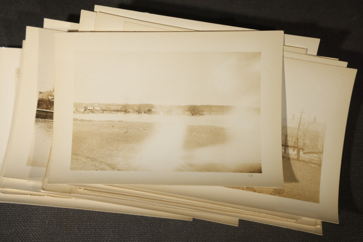 Vintage Grouping of Approximately 40 Snapshot Photographs and Negatives Documenting a Flood in Nashua, New Hampshire, in Fred W. Perkins Photo Finishing Envelope Marked "Flood Films"