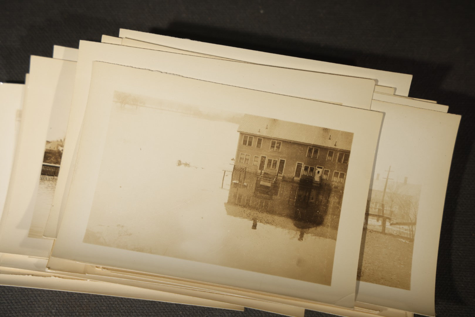 Vintage Grouping of Approximately 40 Snapshot Photographs and Negatives Documenting a Flood in Nashua, New Hampshire, in Fred W. Perkins Photo Finishing Envelope Marked "Flood Films"