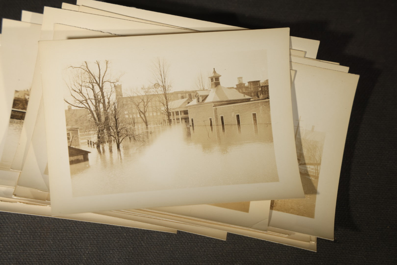 Vintage Grouping of Approximately 40 Snapshot Photographs and Negatives Documenting a Flood in Nashua, New Hampshire, in Fred W. Perkins Photo Finishing Envelope Marked "Flood Films"