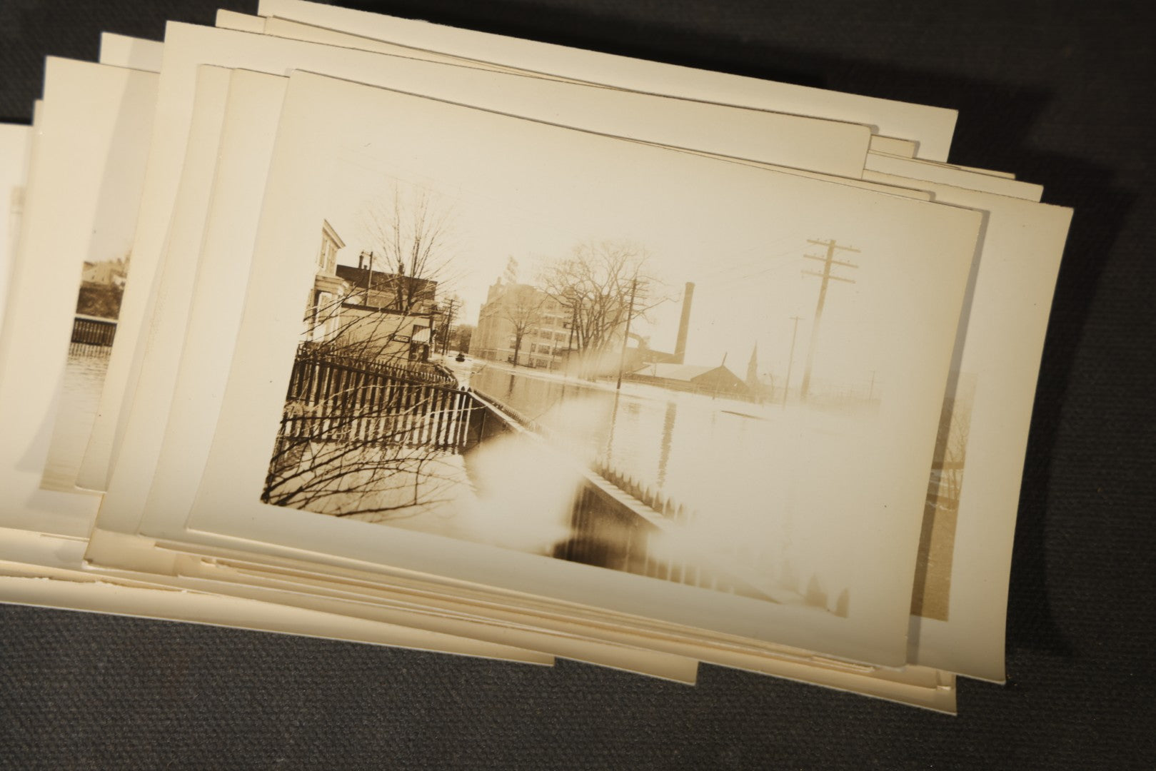 Vintage Grouping of Approximately 40 Snapshot Photographs and Negatives Documenting a Flood in Nashua, New Hampshire, in Fred W. Perkins Photo Finishing Envelope Marked "Flood Films"