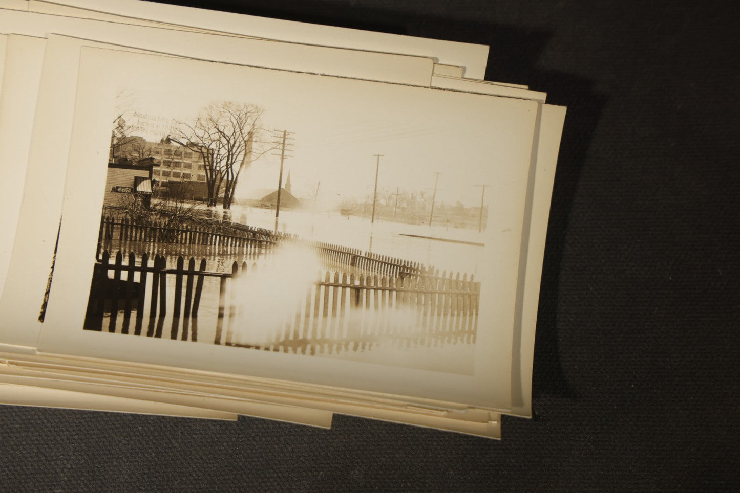 Vintage Grouping of Approximately 40 Snapshot Photographs and Negatives Documenting a Flood in Nashua, New Hampshire, in Fred W. Perkins Photo Finishing Envelope Marked "Flood Films"