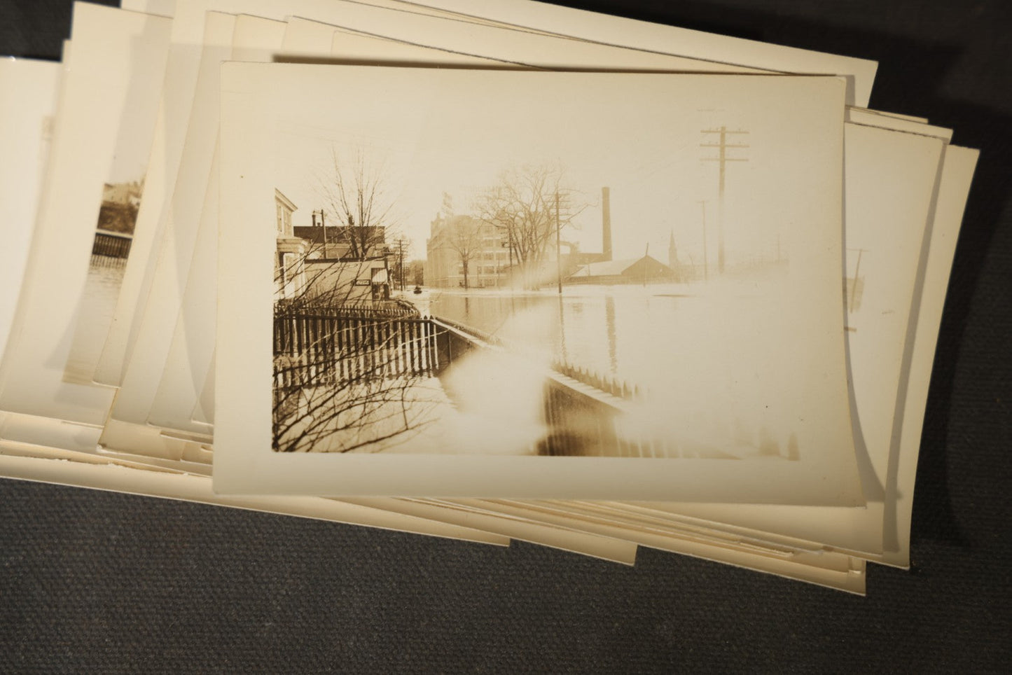 Vintage Grouping of Approximately 40 Snapshot Photographs and Negatives Documenting a Flood in Nashua, New Hampshire, in Fred W. Perkins Photo Finishing Envelope Marked "Flood Films"
