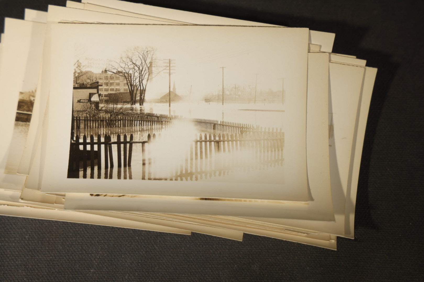 Vintage Grouping of Approximately 40 Snapshot Photographs and Negatives Documenting a Flood in Nashua, New Hampshire, in Fred W. Perkins Photo Finishing Envelope Marked "Flood Films"