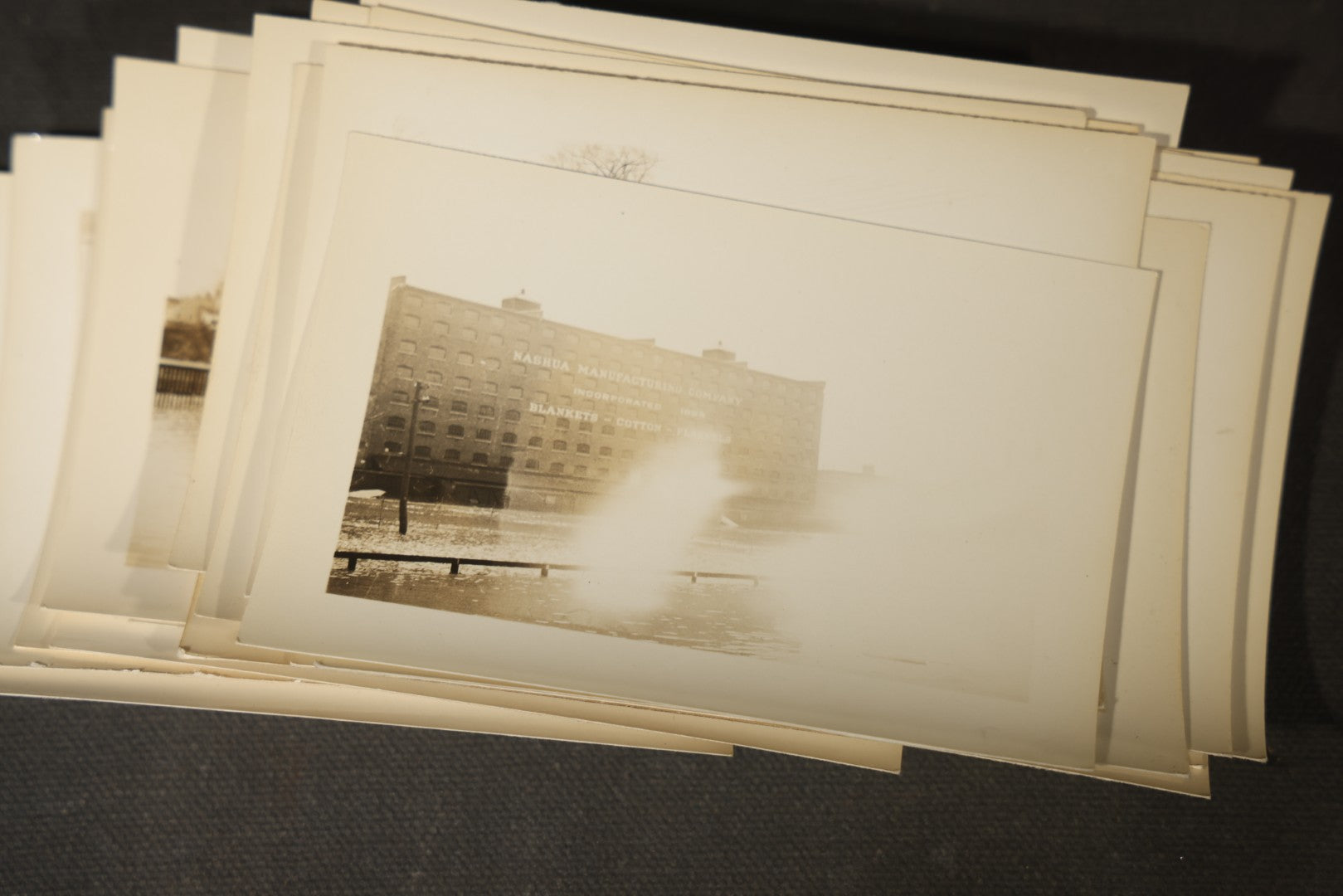 Vintage Grouping of Approximately 40 Snapshot Photographs and Negatives Documenting a Flood in Nashua, New Hampshire, in Fred W. Perkins Photo Finishing Envelope Marked "Flood Films"