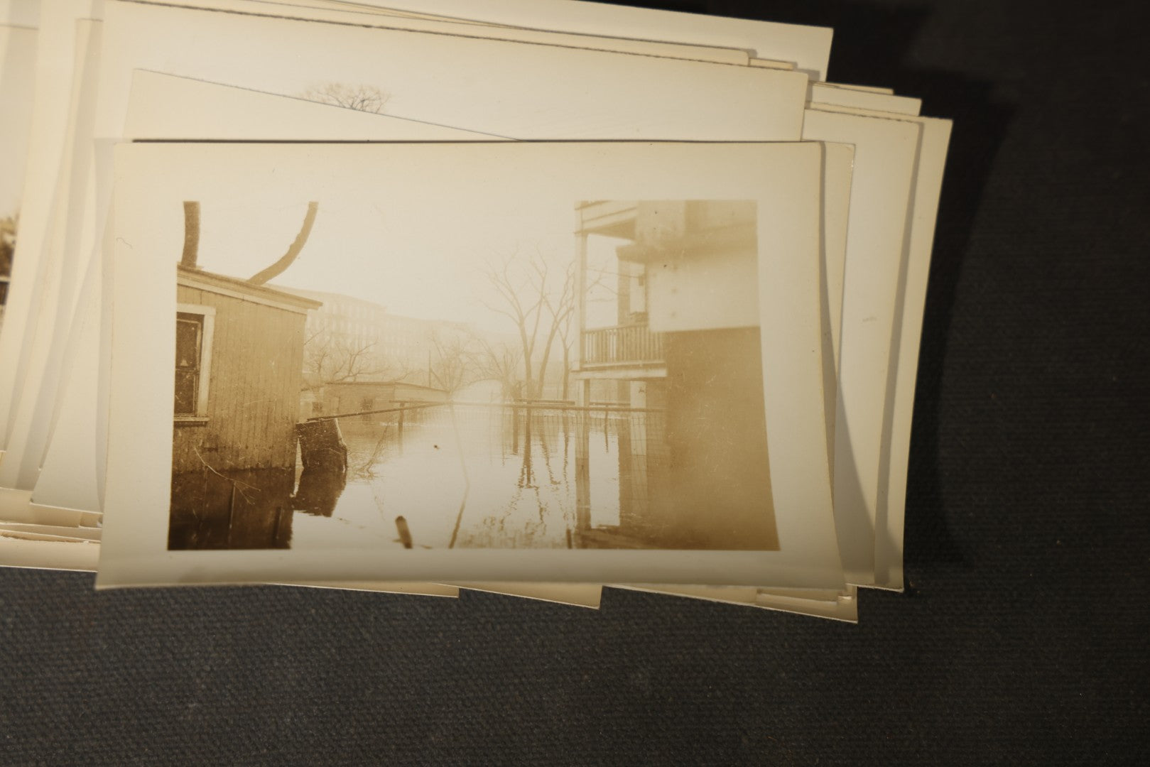 Vintage Grouping of Approximately 40 Snapshot Photographs and Negatives Documenting a Flood in Nashua, New Hampshire, in Fred W. Perkins Photo Finishing Envelope Marked "Flood Films"