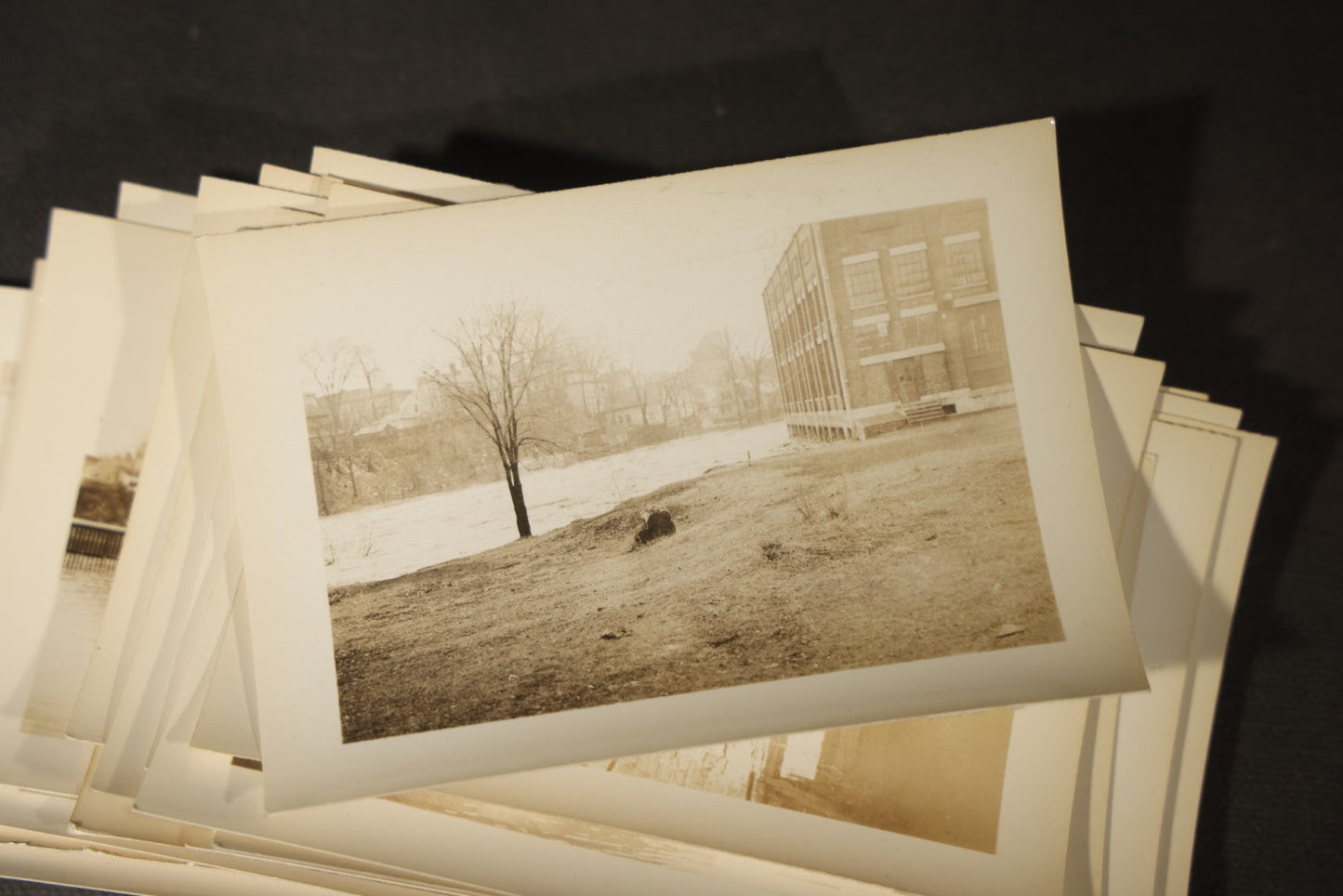 Vintage Grouping of Approximately 40 Snapshot Photographs and Negatives Documenting a Flood in Nashua, New Hampshire, in Fred W. Perkins Photo Finishing Envelope Marked "Flood Films"