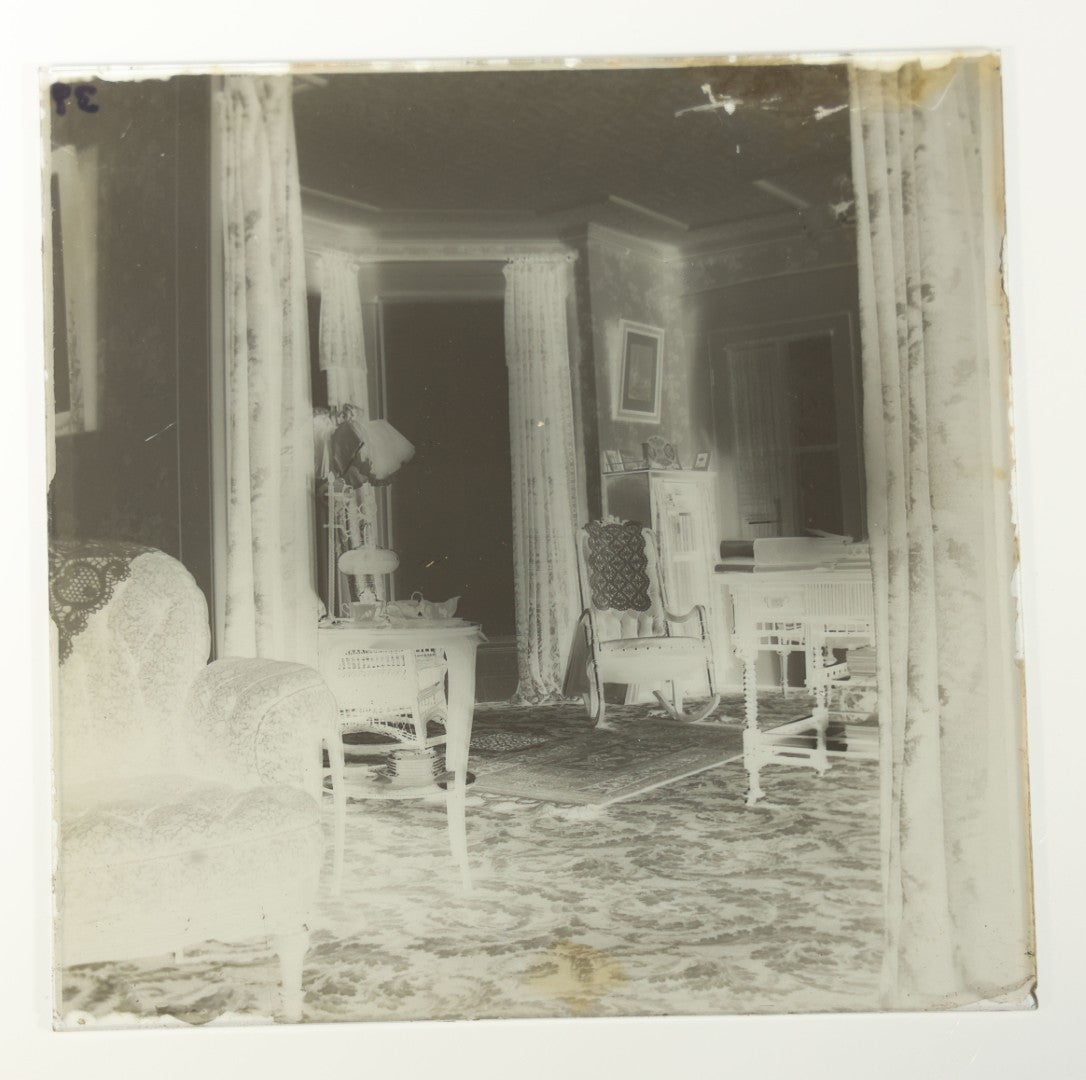Grouping of 38 Antique Glass Plate Photographic Negatives including Interior and Exterior Views, Portraits, and Domestic Scenes
