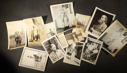 Grouping of 14 Vintage Snapshot Photographs of Costumes, Masks, and Oddities including Grim Reaper Painted Smock, Barber Shop Gag Scene, and Camp Blanding Military Stunt