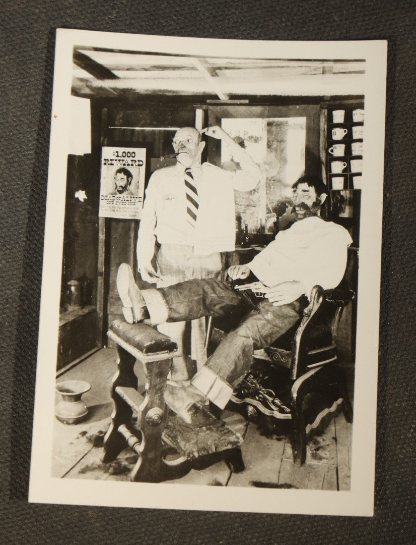 Grouping of 14 Vintage Snapshot Photographs of Costumes, Masks, and Oddities including Grim Reaper Painted Smock, Barber Shop Gag Scene, and Camp Blanding Military Stunt