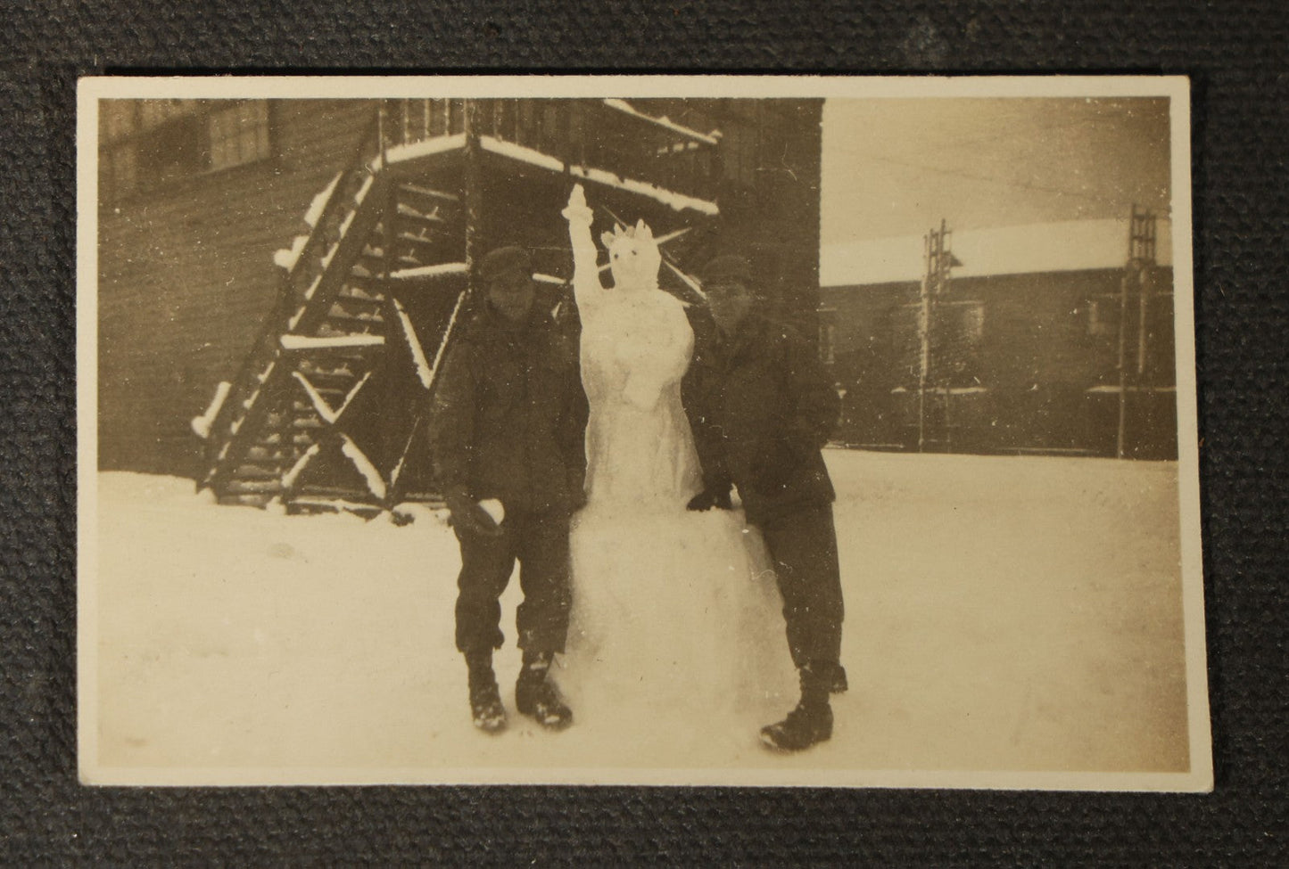 Grouping of 14 Vintage Snapshot Photographs of Costumes, Masks, and Oddities including Grim Reaper Painted Smock, Barber Shop Gag Scene, and Camp Blanding Military Stunt