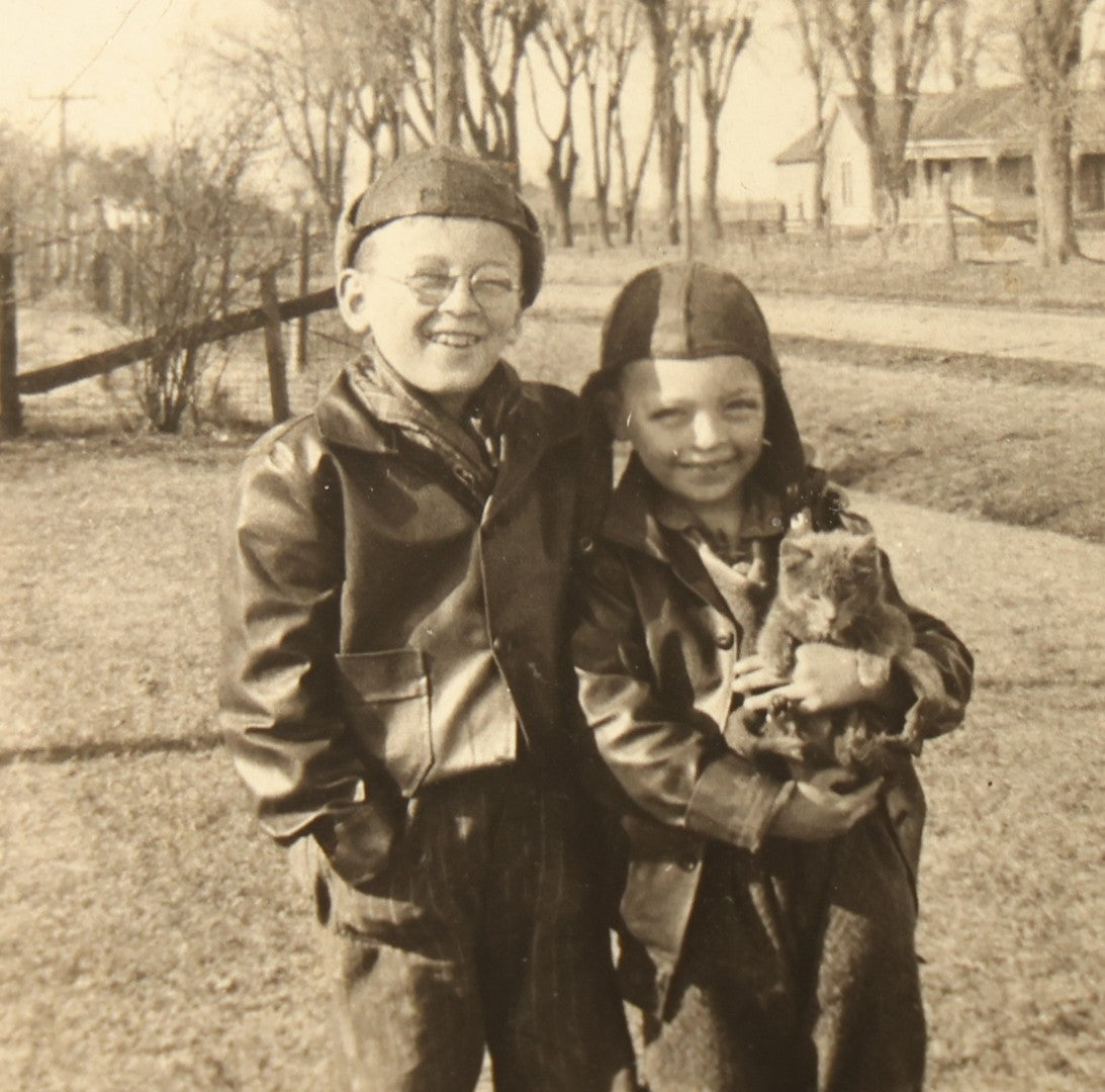 Grouping of 14 Vintage Snapshot Photographs of Costumes, Masks, and Oddities including Grim Reaper Painted Smock, Barber Shop Gag Scene, and Camp Blanding Military Stunt