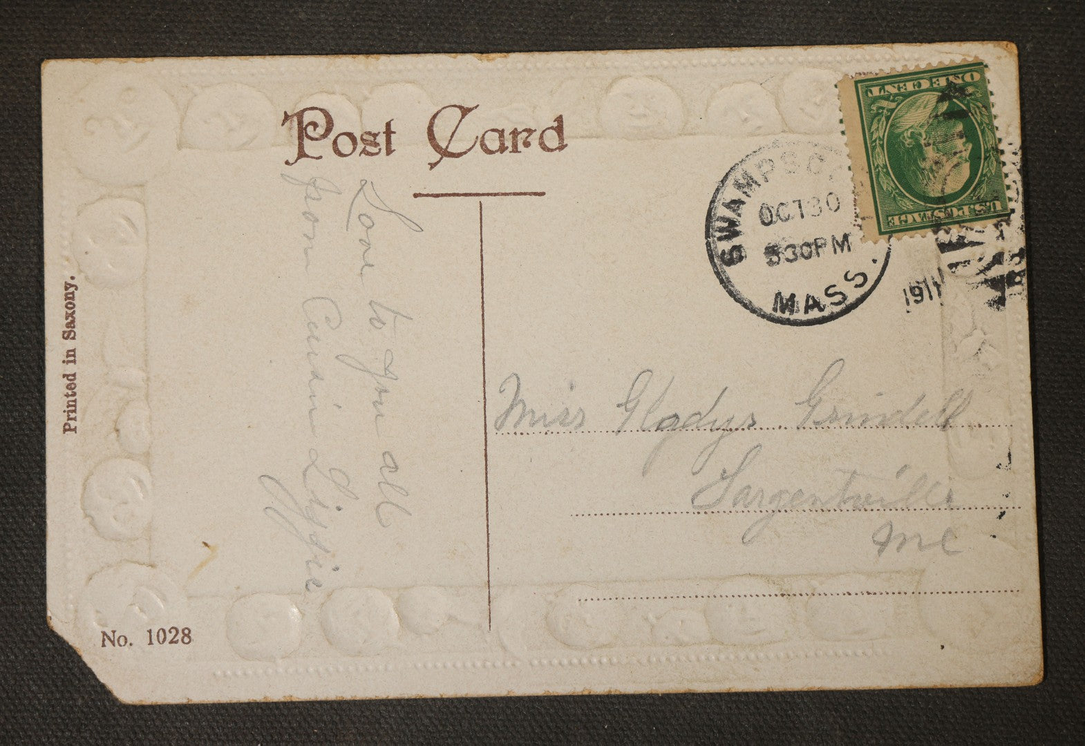 Antique Halloween Postcard with Jack-O-Lantern Lanterns, Bonfire, and Embossed Moon Face Border, "Oct. 31st," No. 1028, Printed in Saxony, Postmarked 1911, Swampscott, Massachusetts