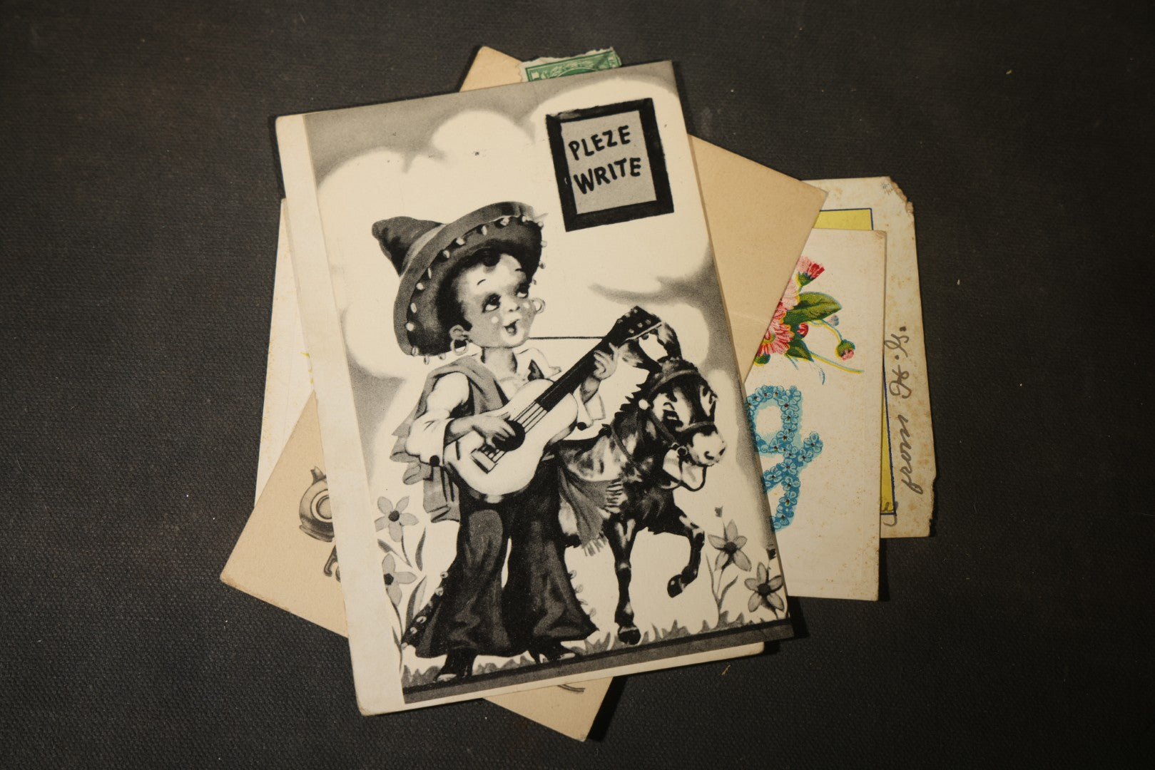Grouping of approximately 25 Antique and Vintage Postcards including Comic, Greeting, Floral, and Holiday Subjects