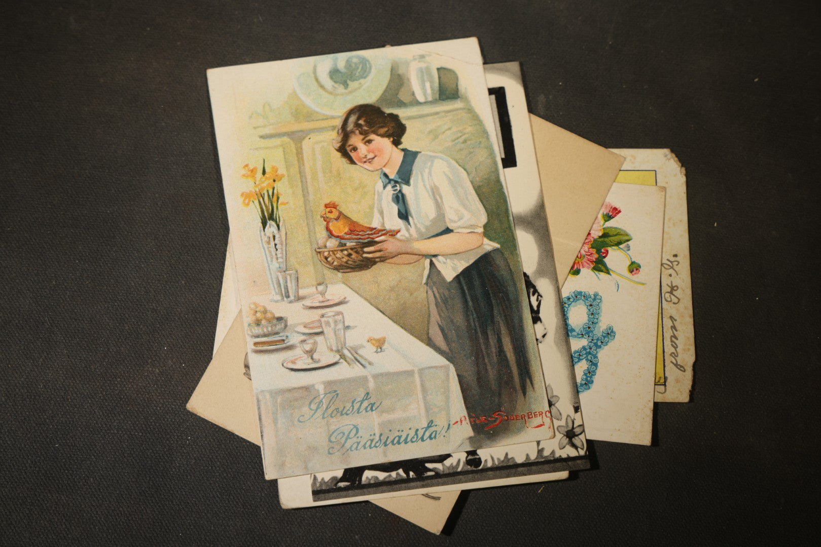 Grouping of approximately 25 Antique and Vintage Postcards including Comic, Greeting, Floral, and Holiday Subjects