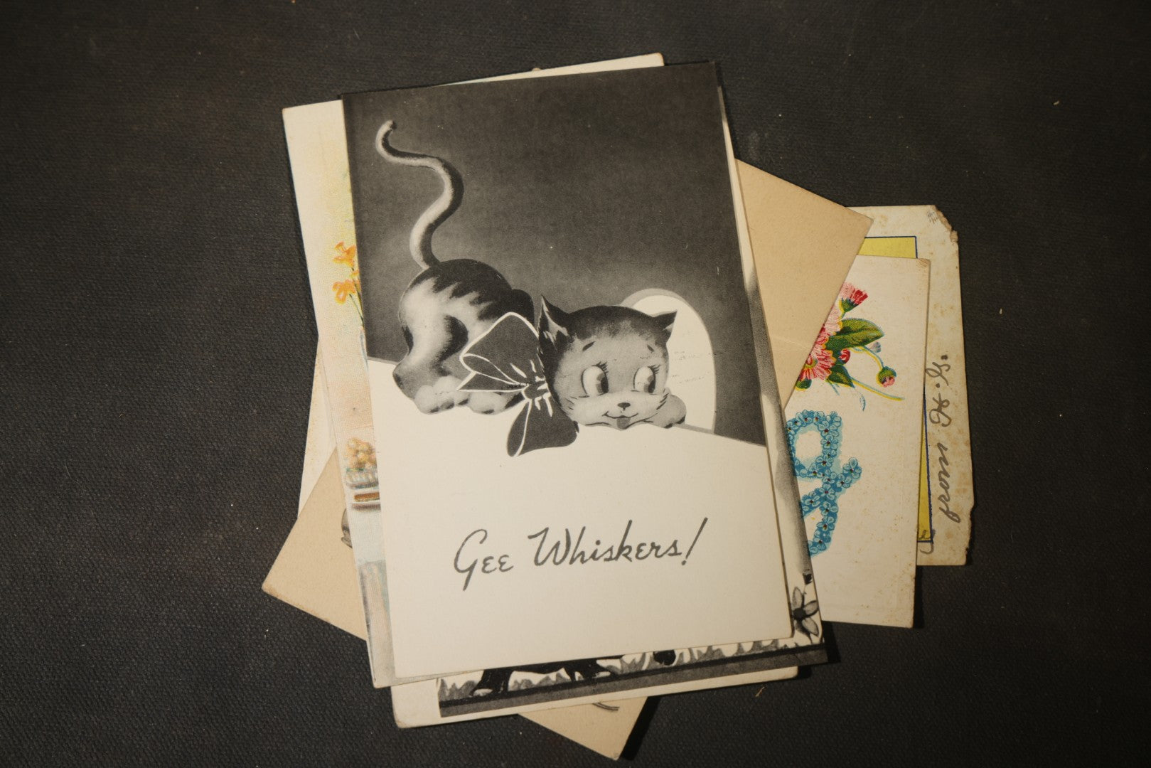 Grouping of approximately 25 Antique and Vintage Postcards including Comic, Greeting, Floral, and Holiday Subjects