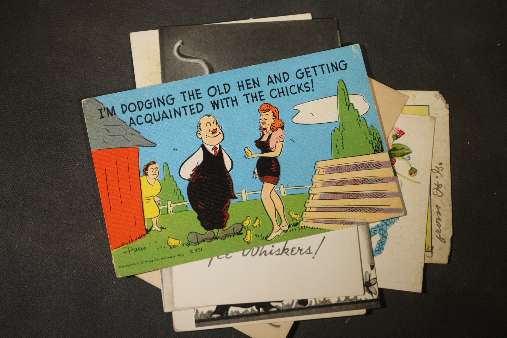 Grouping of approximately 25 Antique and Vintage Postcards including Comic, Greeting, Floral, and Holiday Subjects