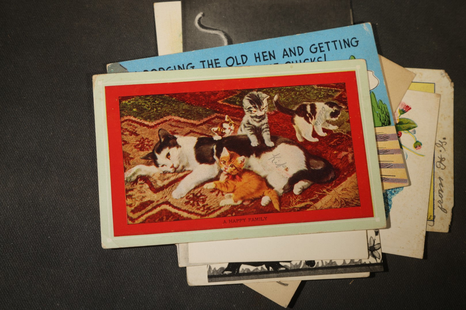 Grouping of approximately 25 Antique and Vintage Postcards including Comic, Greeting, Floral, and Holiday Subjects
