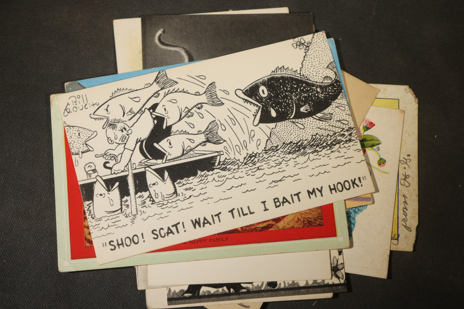 Grouping of approximately 25 Antique and Vintage Postcards including Comic, Greeting, Floral, and Holiday Subjects