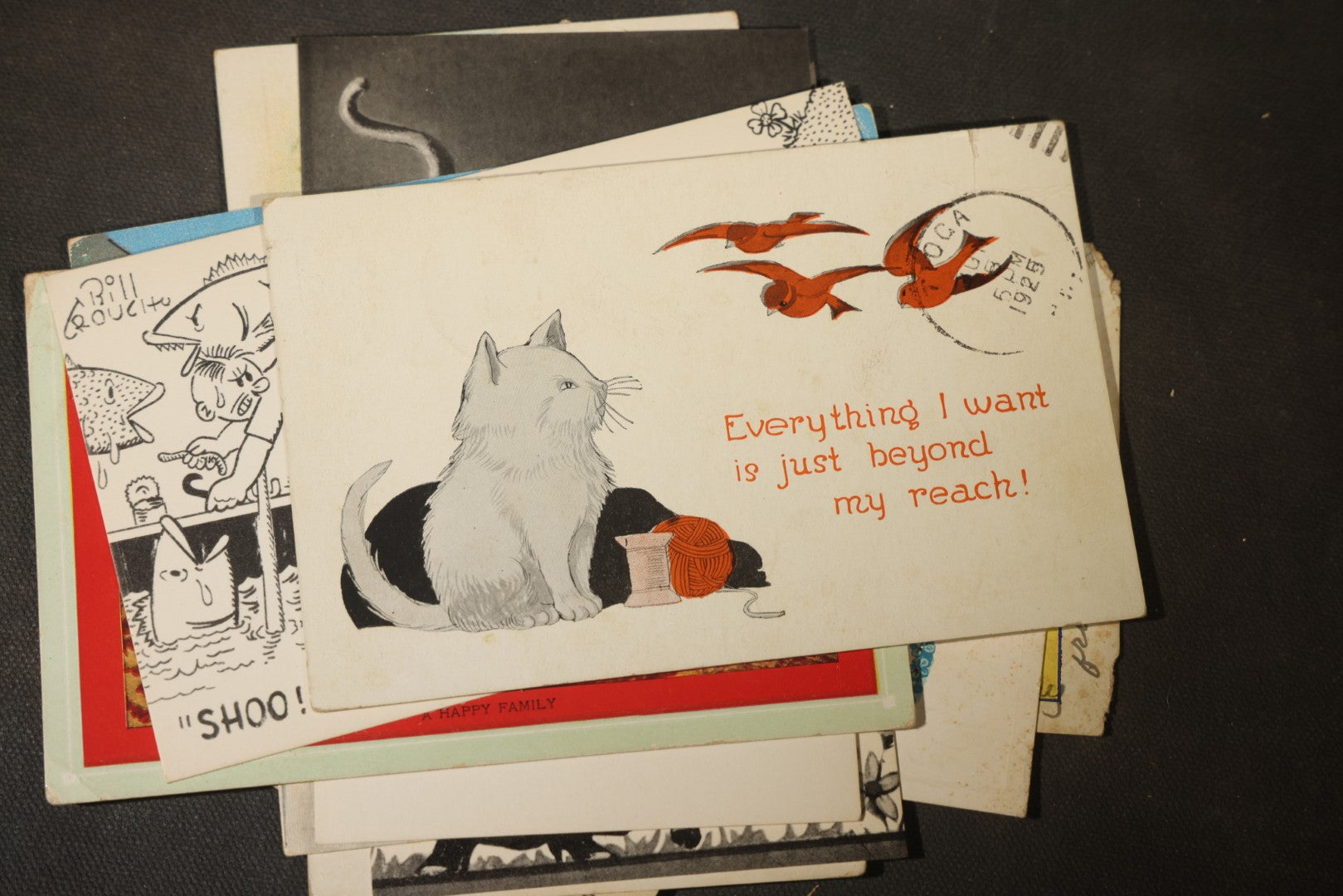 Grouping of approximately 25 Antique and Vintage Postcards including Comic, Greeting, Floral, and Holiday Subjects